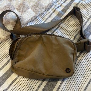 Lululemon belt bag in color Artifact